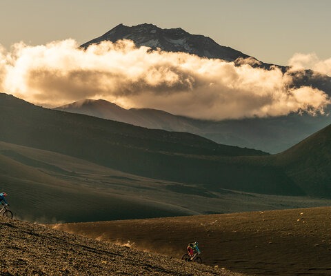 Chilean mountain bike guide Ernesto “Máquina” Araneda leads writer Andrew Findlay down a slope of volcanic debris in the shadow of the towering Volcán Lonquimay, which last erupted violently on Christmas Day in 1988.